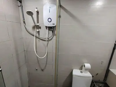 a shower in a bathroom with a toilet at Fahrenheit88 Suites Bukit Bintang A 2R in Kuala Lumpur