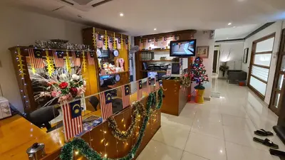a store with christmas decorations and christmas trees at BG Travelers Home in Kuala Lumpur