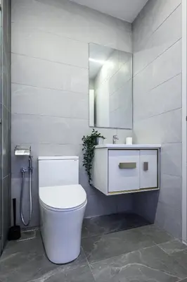 a bathroom with a white toilet and a mirror at Majestic Residence KLCC Royal Premium King Bed in Kuala Lumpur