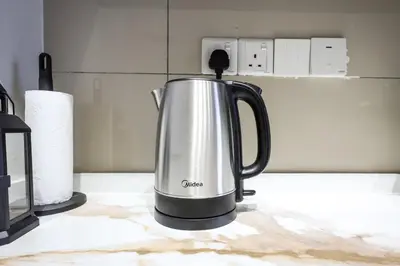 a coffee kettle sitting on a kitchen counter at Majestic Residence KLCC Royal Premium King Bed in Kuala Lumpur