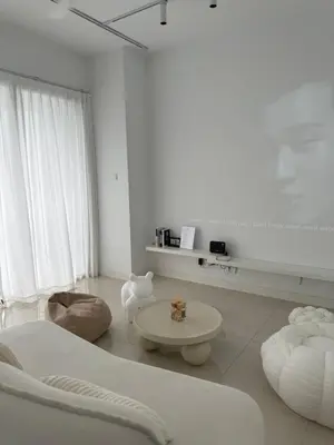 a white living room with a couch and a table at CherasCochrane walkto MRT Near TRX, KLCC, pavilion in Kuala Lumpur