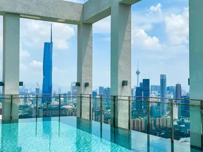 a swimming pool on top of a building with a view at Trion 2 KL Cityview Suites by CityNest in Kuala Lumpur