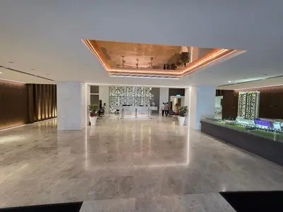 a large lobby with a large hall with people in it at Quill KLCC By Signature in Kuala Lumpur