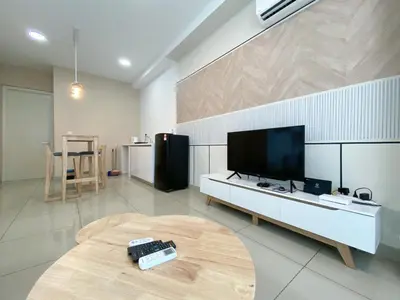 a living room with a tv and a table at Arte Plus Ampang Free Parking By Paradgm Stay in Batu Empat