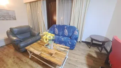 a living room with a couch and a coffee table at BT Apartment times square kl in Kuala Lumpur