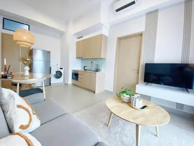 a living room with a couch and a table at The Colony Infinitum By Paradgm Nest Stay in Kuala Lumpur