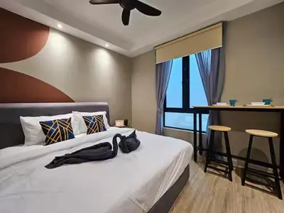 a bedroom with a bed with a ceiling fan at Casa Residency Family CityView Suites by CityNest in Kuala Lumpur