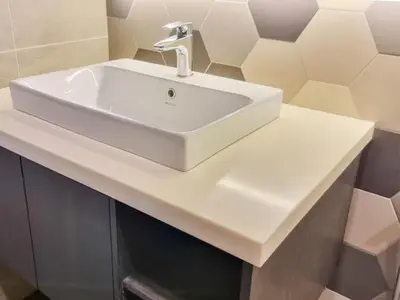 a white sink with a faucet on a counter at KL City Designer Studio in Ceylonz with KL118 Tower View CityNest in Kuala Lumpur