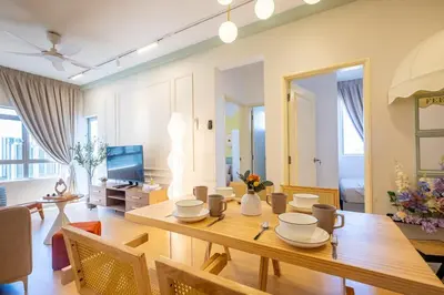 a dining room and living room with a wooden table at Bright 3BR Kids Café Home Slide LEGO Playroom in Kuala Lumpur