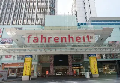 a store with a sign on the front of a building at Fahrenheit 88 Suites, Bukit Bintang 4R in Kuala Lumpur