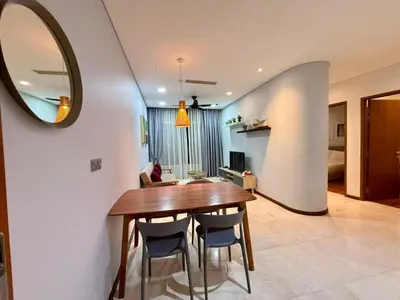 a dining room with a table and chairs and a mirror at Apartment KL Luxury Home Stay in Kuala Lumpur