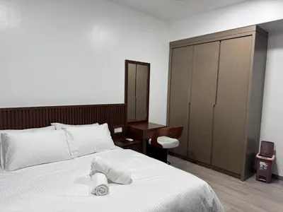 a bedroom with a bed with a towel on it at Agile Bukit Bintang By ERYSHAH in Kuala Lumpur