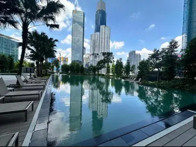 a large swimming pool in a city with tall buildings at Agile Bukit Bintang By ERYSHAH in Kuala Lumpur