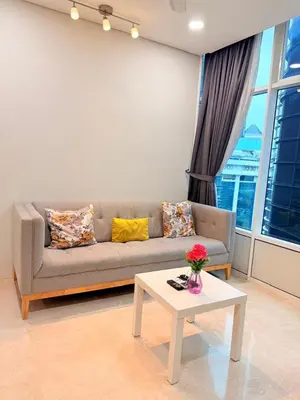 a living room with a couch and a table at Sky Suites KLCC by Apartment TD Luxury in Kuala Lumpur