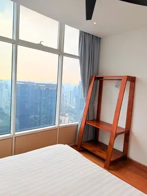 a bedroom with a ladder next to a bed and a window at Sky Suites KLCC by Apartment TD Luxury in Kuala Lumpur