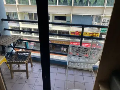a view from a window of a store with a shopping cart at China Town Dorm by ichiro in Kuala Lumpur