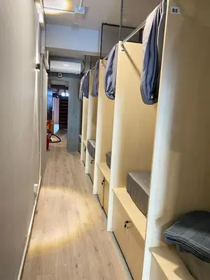 a hallway of a room with many bunk beds at China Town Dorm by ichiro in Kuala Lumpur