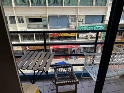 a view of a table and chairs from a window at China Town Dorm by ichiro in Kuala Lumpur