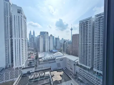 an aerial view of a city with tall buildings at KLCC View Majestic Lovely Studio with Rooftop Pool in Kuala Lumpur