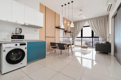 a kitchen with a washing machine and a dining room at Continew Residence 10MIN To KLCC With Board Games Fit Up To 6PAX in Kuala Lumpur