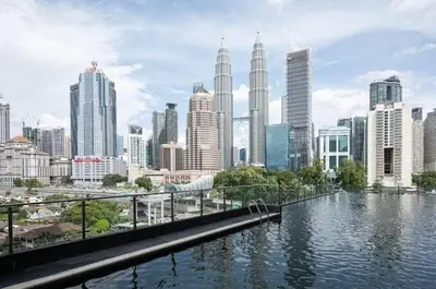 a view of a city with a river and buildings at Legasi Residence Direct KLCC VIEW Only10minWalkToKLCC With PS4 AndBoardGames in Kuala Lumpur