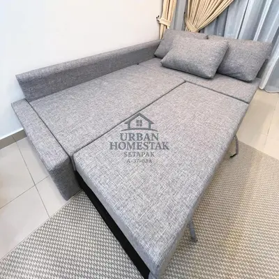 a couch in the corner of a room at Urban Homestay Setapak MHP2 Kids Friendly in Kuala Lumpur