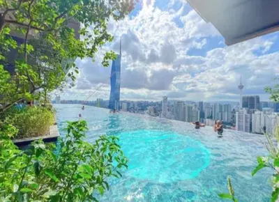 a large swimming pool on top of a city at Lucentia Residence in Kuala Lumpur