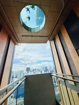 a view of the city from a balcony in a building at Lucentia Residence in Kuala Lumpur