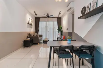 a kitchen and living room with a table and chairs at Kenwingston Platz 15 MINS TO KLCC Fit 5 Pax With Board games in Kuala Lumpur