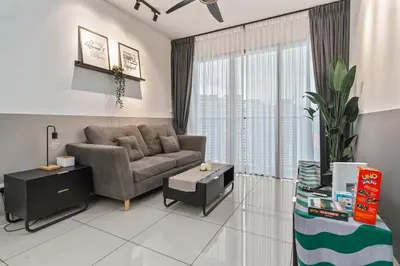 a living room with a couch and a table at Kenwingston Platz 15 MINS TO KLCC Fit 5 Pax With Board games in Kuala Lumpur