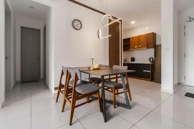 a kitchen and dining room with a table and chairs at Kenwingston Platz 15MINS TO KLCC Modern Interior Boardgames A26 in Kuala Lumpur