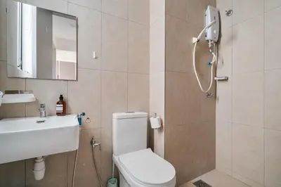 a bathroom with a toilet and a sink and a shower at Kenwingston Platz 15MINS TO KLCC Modern Interior Boardgames A26 in Kuala Lumpur