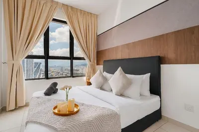 a bedroom with a large bed with a large window at Kenwingston Platz Facing KLCC VIEW 15Mins To KLCC Fit 9Pax A24 in Kuala Lumpur