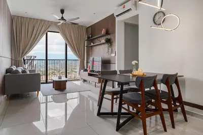a dining room with a table and chairs in a room at Kenwingston Platz Facing KLCC VIEW 15Mins To KLCC Fit 9Pax A24 in Kuala Lumpur