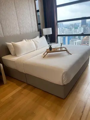 a large bed in a room with a large window at Majestic Residence Kuala lumpur by Luxury in Kuala Lumpur