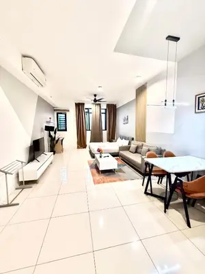 a living room with a couch and a table at Klcc Suites 1 By Chambers RMS in Kuala Lumpur