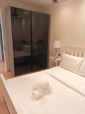 a white towel sitting on top of a bed at Rahmans Care At Star Residence KLCC in Kuala Lumpur