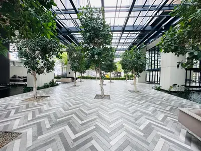 a building with trees in the middle of a hallway at Lucentia Residence At Bukit Bintang KLCC Pavilion in Kuala Lumpur