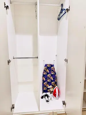 a white locker room with a helmet and a ball at Lucentia Residence At Bukit Bintang KLCC Pavilion in Kuala Lumpur