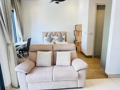 a living room with a couch and a bed at Lucentia Residence At Bukit Bintang KLCC Pavilion in Kuala Lumpur