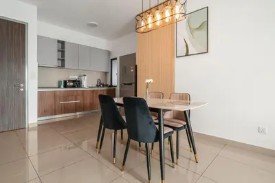 a kitchen and dining room with a table and chairs at M Vertica KLCC View IKEA Velocity in Kuala Lumpur