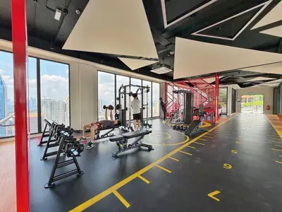 a gym with treadmills and machines in a building at KLCC View Majestic Cozy Studio with Rooftop Pool in Kuala Lumpur