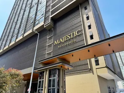 a building with a sign on the side of it at Majestic Luxe 1BR Apt with KLCC View Rooftop Pool in Kuala Lumpur