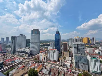 a view of a city with many tall buildings at Majestic Luxe 1BR Apt with KLCC View Rooftop Pool in Kuala Lumpur