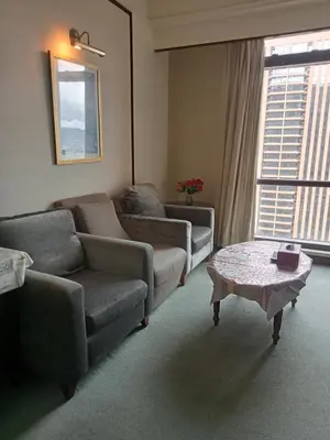 a living room with a couch and a coffee table at Arba Suite Times Square KL in Kuala Lumpur