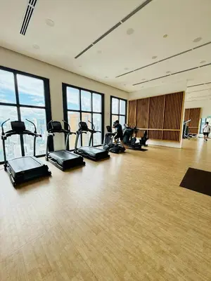 a gym with a bunch of exercise bikes in a room at Studio Apartment Lucentia Residence in Kuala Lumpur