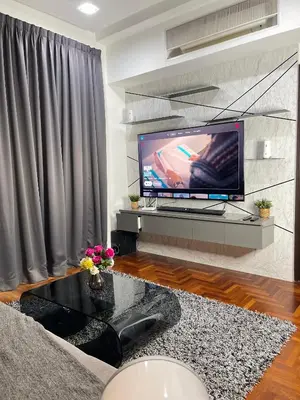 a living room with a tv and a couch at The Mews Klcc by Annie in Kuala Lumpur