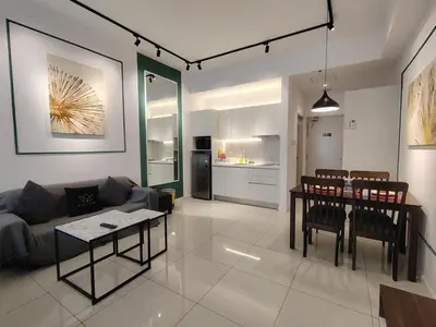 a living room with a couch and a table at CHAMBERS RESIDENCE KLCC By DELUXE HOME in Kuala Lumpur