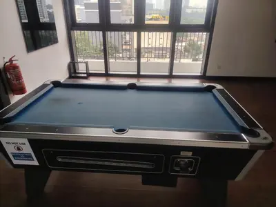 a pool table in a room with a window at CHAMBERS RESIDENCE KLCC By DELUXE HOME in Kuala Lumpur