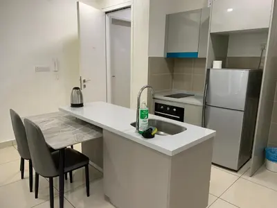 a kitchen with a sink and a refrigerator at Homestay at Trion Kuala Lumpur in Kuala Lumpur